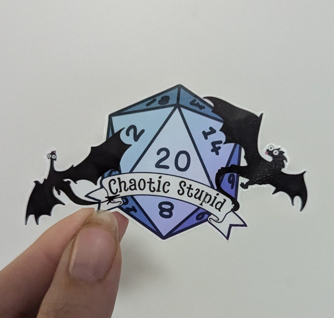 Chaotic Stupid d20 | crit success | silhouette | dragon in flight | waterproof | vinyl | laminated