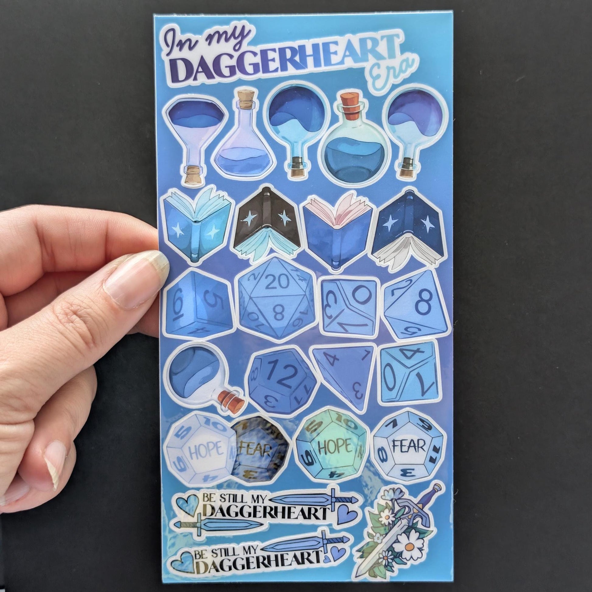 Daggerheart themed sticker sheet | laminated, waterproof | journaling and other uses | potions, dice, swords, books